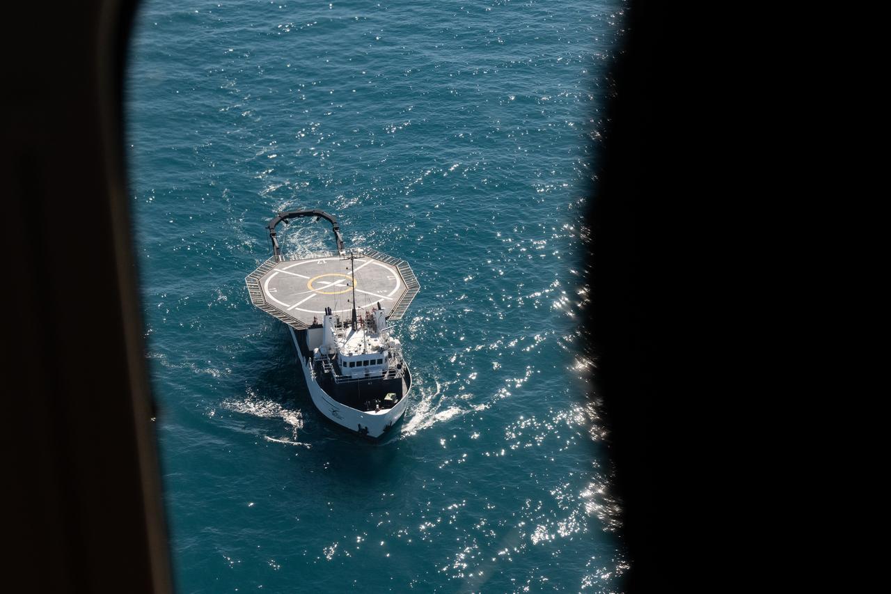 The SpaceX recovery ship MEGAN is seen as the recovery team prepares for the landing of a SpaceX Dragon spacecraft with NASA astronauts Nick Hague, Suni Williams, Butch Wilmore, and Roscosmos cosmonaut Aleksandr Gorbunov aboard, Tuesday, March 18, 2025, off the coast of Tallahassee, Florida. Hague, Gorbunov, Williams, and Wilmore are returning from a long-duration science expedition aboard the International Space Station. Photo Credit: (NASA/Keegan Barber)