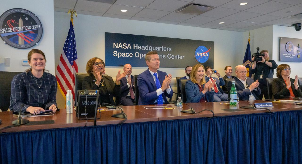 NASA Deputy Associate Administrator Casey Swails, left, acting NASA Associate Administrator Vanessa Wyche, U.S. Transportation Secretary Sean Duffy, acting NASA Administrator Janet Petro, NASA Associate Administrator for the Space Operations Mission Directorate Ken Bowersox, and NASA Director of the International Space Station and acting director of the Commercial Spaceflight Division, Robyn Gatens, react as they watch the SpaceX Dragon spacecraft splash down with NASA astronauts Butch Wilmore, Suni Williams, Nick Hague, and Roscosmos cosmonaut Aleksandr Gorbunov, Tuesday, March 18, 2025, from the Space Operations Center at the Mary W. Jackson NASA Headquarters Building in Washington. Photo Credit: (NASA/Bill Ingalls)