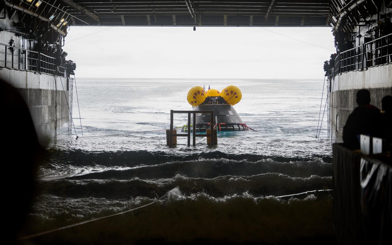 The Crew Module Test Article (CMTA), a full scale mockup of the Orion spacecraft, is seen during Underway Recovery Test-12 onboard USS Somerset off the coast of California, Wednesday, March 26, 2025. During the test, NASA and Department of Defense teams are practicing to ensure recovery procedures are validated as NASA plans to send Artemis II astronauts around the Moon and splashdown in the Pacific Ocean. Photo Credit: (NASA/Joel Kowsky)