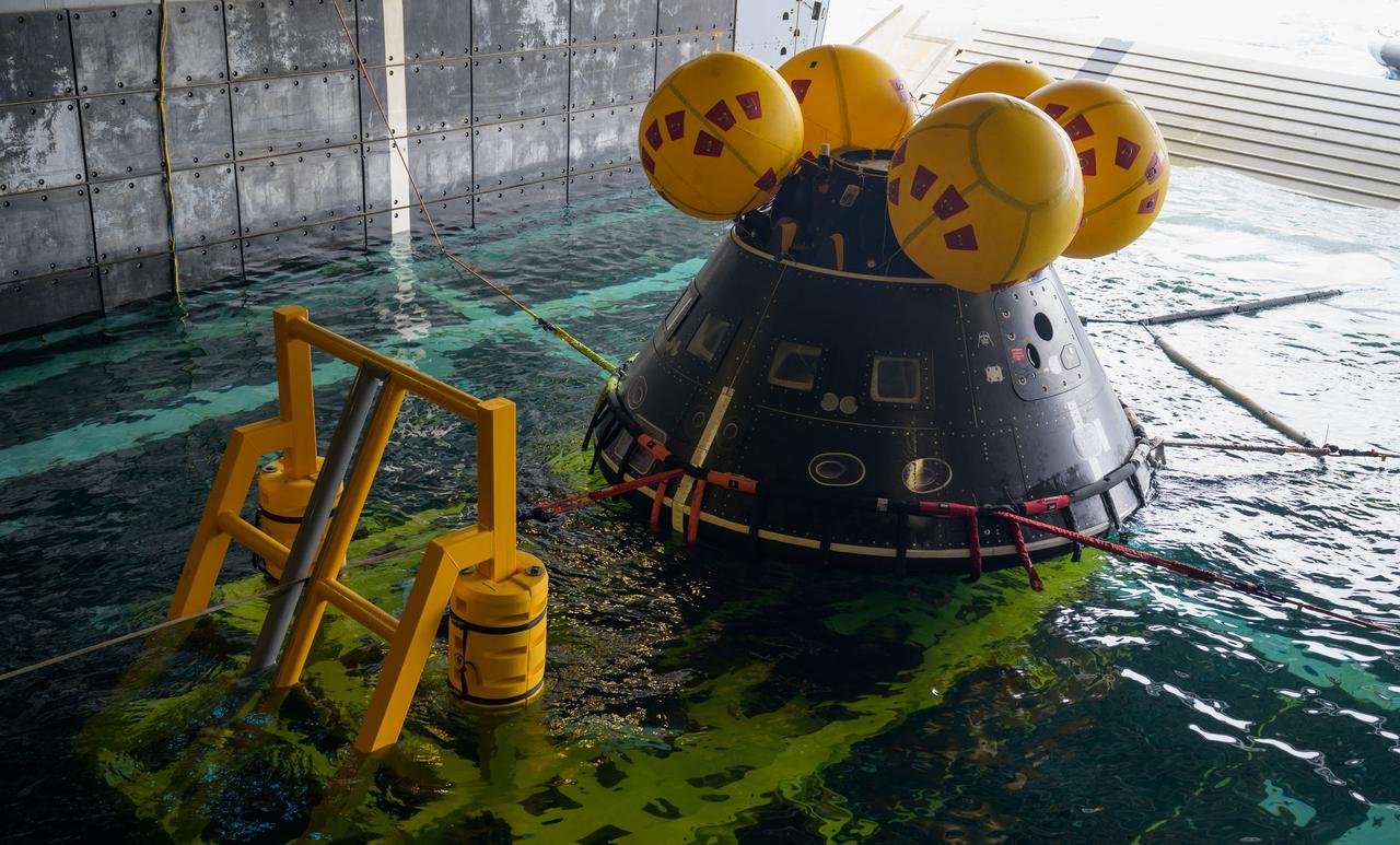 The Crew Module Test Article (CMTA), a full scale mockup of the Orion spacecraft, is seen during Underway Recovery Test-12 onboard USS Somerset off the coast of California, Wednesday, March 26, 2025. During the test, NASA and Department of Defense teams are practicing to ensure recovery procedures are validated as NASA plans to send Artemis II astronauts around the Moon and splashdown in the Pacific Ocean. Photo Credit: (NASA/Bill Ingalls)