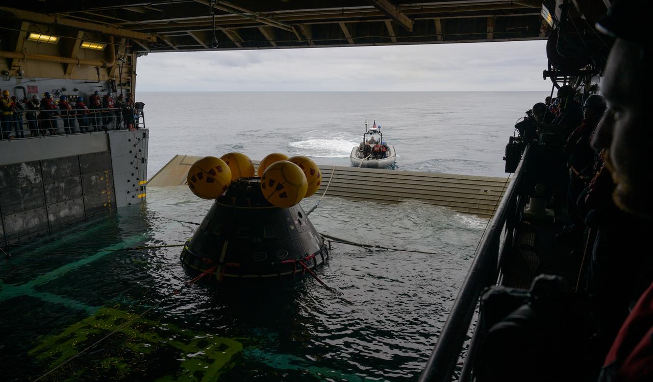 The Crew Module Test Article (CMTA), a full scale mockup of the Orion spacecraft, is seen during Underway Recovery Test-12 onboard USS Somerset off the coast of California, Wednesday, March 26, 2025. During the test, NASA and Department of Defense teams are practicing to ensure recovery procedures are validated as NASA plans to send Artemis II astronauts around the Moon and splashdown in the Pacific Ocean. Photo Credit: (NASA/Bill Ingalls)