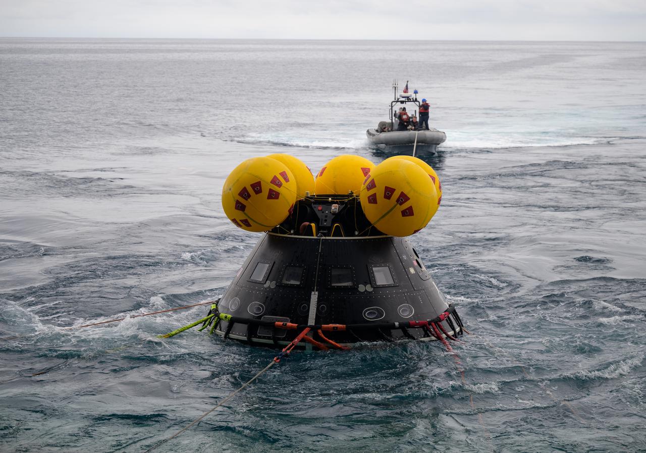 The Crew Module Test Article (CMTA), a full scale mockup of the Orion spacecraft, is seen during Underway Recovery Test-12 onboard USS Somerset off the coast of California, Wednesday, March 26, 2025. During the test, NASA and Department of Defense teams are practicing to ensure recovery procedures are validated as NASA plans to send Artemis II astronauts around the Moon and splashdown in the Pacific Ocean. Photo Credit: (NASA/Bill Ingalls)
