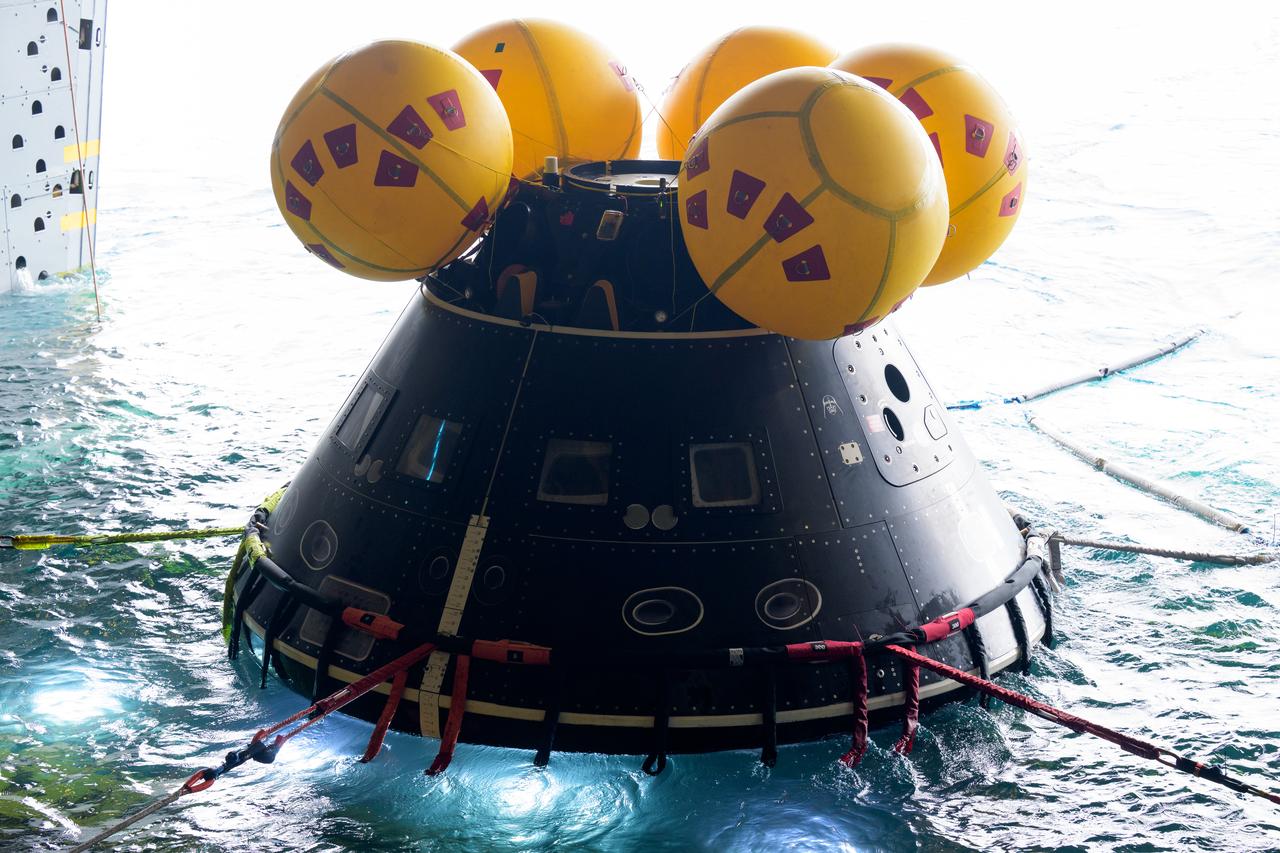 The Crew Module Test Article (CMTA), a full scale mockup of the Orion spacecraft, is seen during Underway Recovery Test-12 onboard USS Somerset off the coast of California, Wednesday, March 26, 2025. During the test, NASA and Department of Defense teams are practicing to ensure recovery procedures are validated as NASA plans to send Artemis II astronauts around the Moon and splashdown in the Pacific Ocean. Photo Credit: (NASA/Bill Ingalls)