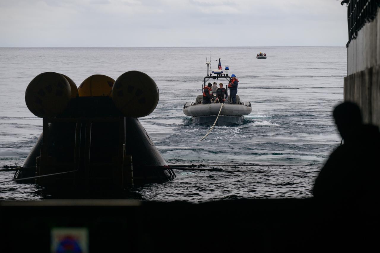 The Crew Module Test Article (CMTA), a full scale mockup of the Orion spacecraft, is seen during Underway Recovery Test-12 onboard USS Somerset off the coast of California, Wednesday, March 26, 2025. During the test, NASA and Department of Defense teams are practicing to ensure recovery procedures are validated as NASA plans to send Artemis II astronauts around the Moon and splashdown in the Pacific Ocean. Photo Credit: (NASA/Bill Ingalls)