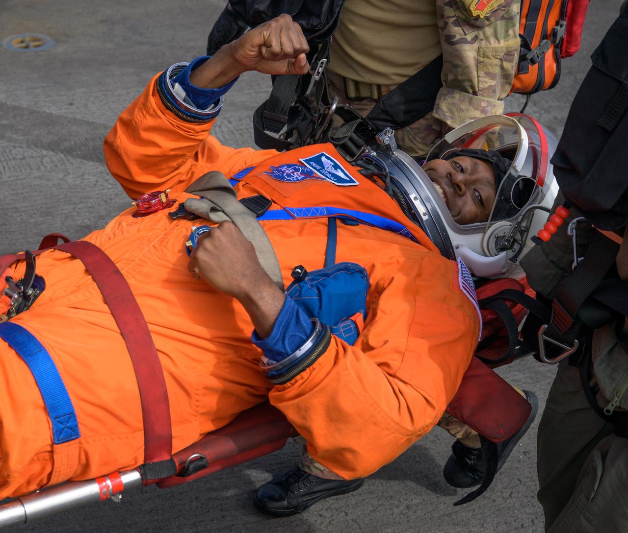NASA astronaut Andre Douglas is carried to the medical bay of USS Somerset during Underway Recovery Test-12 off the coast of California, Thursday, March 27, 2025. During the test, NASA and Department of Defense teams are practicing to ensure recovery procedures are validated as NASA plans to send Artemis II astronauts around the Moon and splashdown in the Pacific Ocean.  Photo Credit: (NASA/Bill Ingalls)