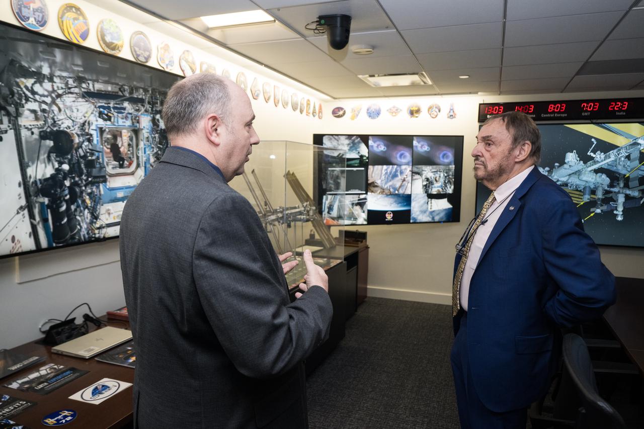 Kevin Metrocavage, NASA Headquarters Space Operations Center (SOC) Manager, Space Operations Mission Directorate, speaks with John Rhys-Davies, the actor best known for his roles as Gimli in The Lord of the Rings trilogy and Sallah in the Indiana Jones franchise, about the International Space Station in the SOC, Friday, March 28, 2025 at the Mary W. Jackson NASA Headquarters building in Washington, DC. Photo Credit: (NASA/Aubrey Gemignani)