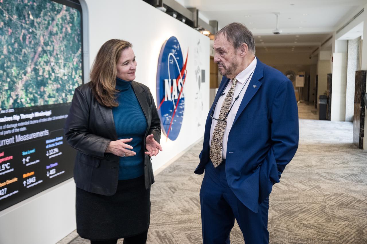 Dr. Karen St. Germain, NASA director of the Earth Science Division, speaks with John Rhys-Davies, the actor best known for his roles as Gimli in The Lord of the Rings trilogy and Sallah in the Indiana Jones franchise at the Earth Information Center (EIC), Friday, March 28, 2025 at the Mary W. Jackson NASA Headquarters building in Washington, DC. Photo Credit: (NASA/Aubrey Gemignani)
