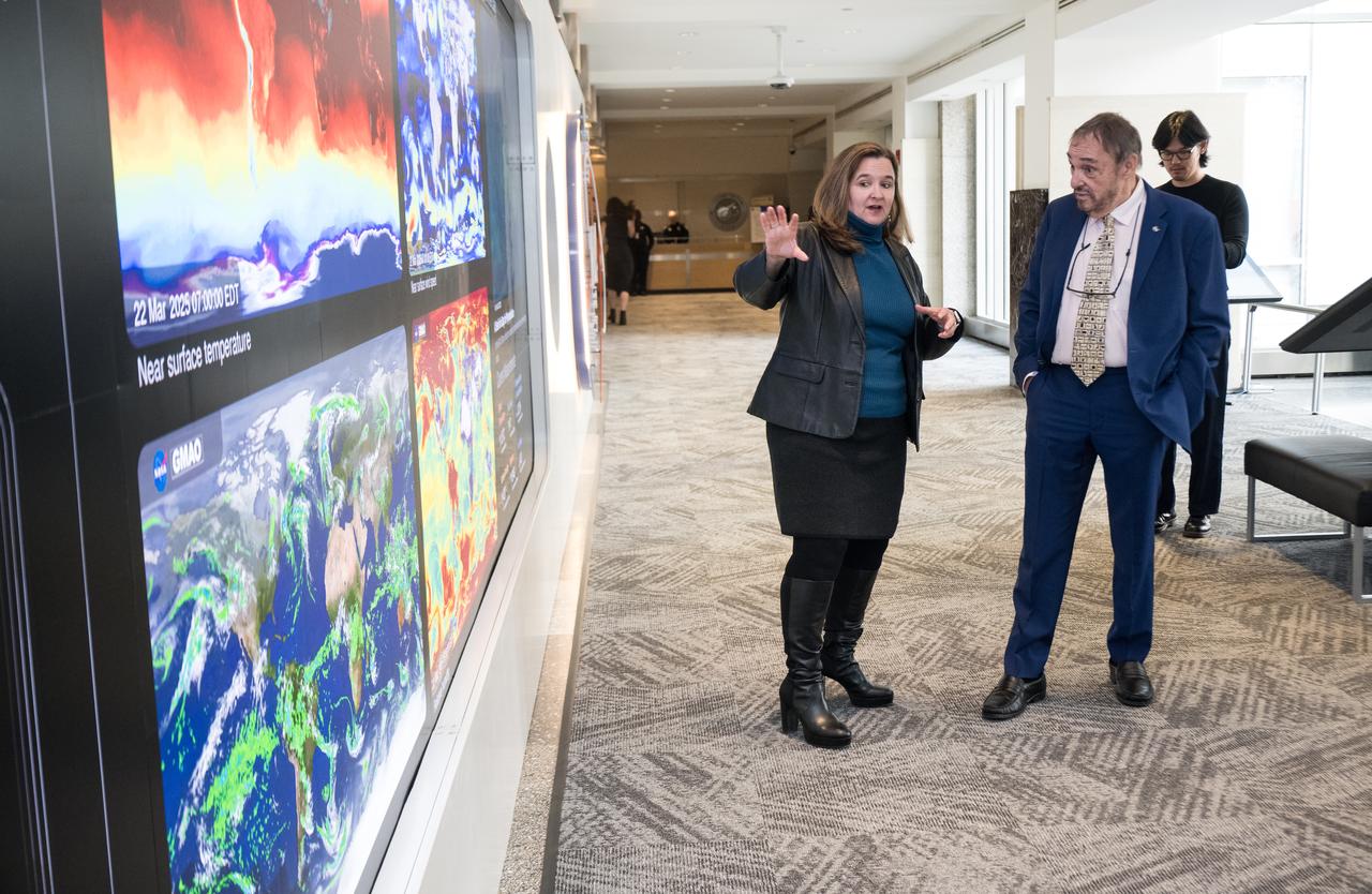 Dr. Karen St. Germain, NASA director of the Earth Science Division, speaks with John Rhys-Davies, the actor best known for his roles as Gimli in The Lord of the Rings trilogy and Sallah in the Indiana Jones franchise at the Earth Information Center (EIC), Friday, March 28, 2025 at the Mary W. Jackson NASA Headquarters building in Washington, DC. Photo Credit: (NASA/Aubrey Gemignani)