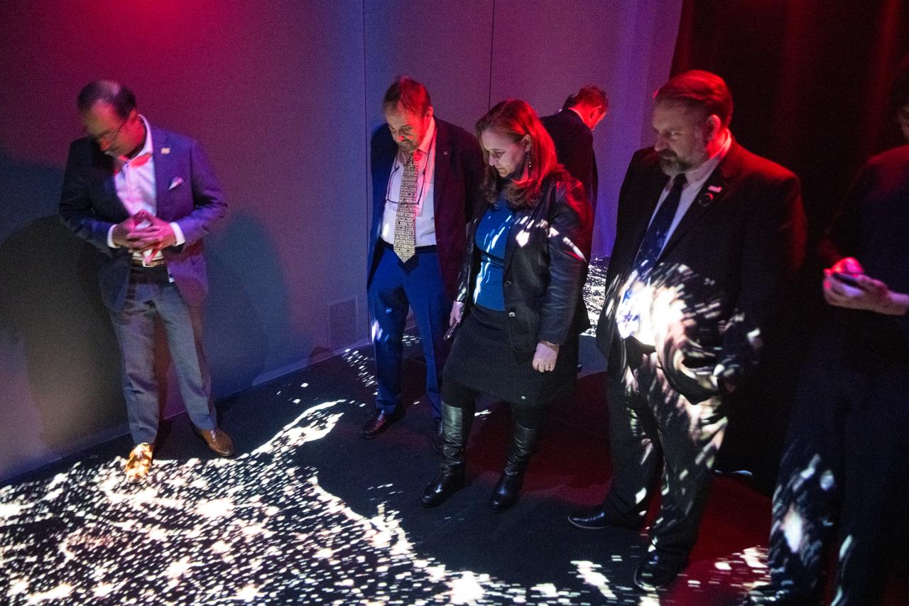 Dr. Karen St. Germain, NASA director of the Earth Science Division, and John Rhys-Davies, the actor best known for his roles as Gimli in The Lord of the Rings trilogy and Sallah in the Indiana Jones franchise, center left, visit the Earth Information Center (EIC), Friday, March 28, 2025 at the Mary W. Jackson NASA Headquarters building in Washington, DC. Photo Credit: (NASA/Aubrey Gemignani)