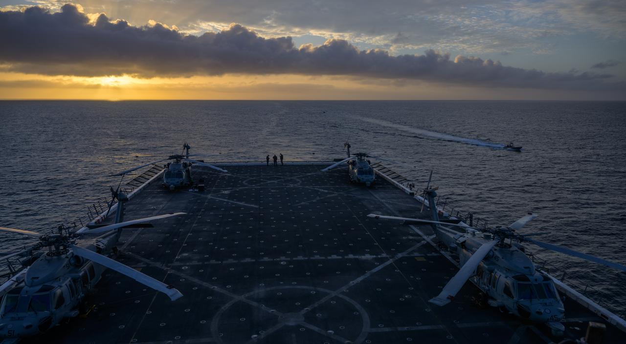 Navy MH-60 Seahawk helicopters are seen onboard USS Somerset off the coast of California, as NASA and Department of Defense teams participate in Underway Recovery Test-12, Friday, March 28, 2025. During the test, teams are practicing to ensure recovery procedures are validated as NASA plans to send the Artemis II astronauts around the Moon and splashdown in the Pacific Ocean.  Photo Credit: (NASA/Bill Ingalls)