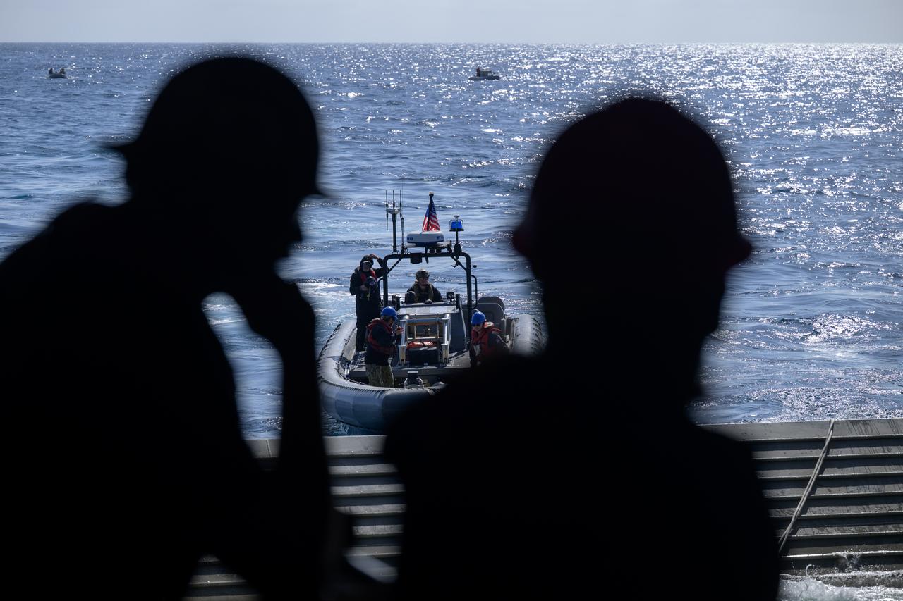 Boats are deployed during the Underway Recovery Test-12 onboard USS Somerset off the coast of California, Friday, March 28, 2025. During the test, NASA and Department of Defense teams are practicing to ensure recovery procedures are validated as NASA plans to send Artemis II astronauts around the Moon and splashdown in the Pacific Ocean.  Photo Credit: (NASA/Bill Ingalls)