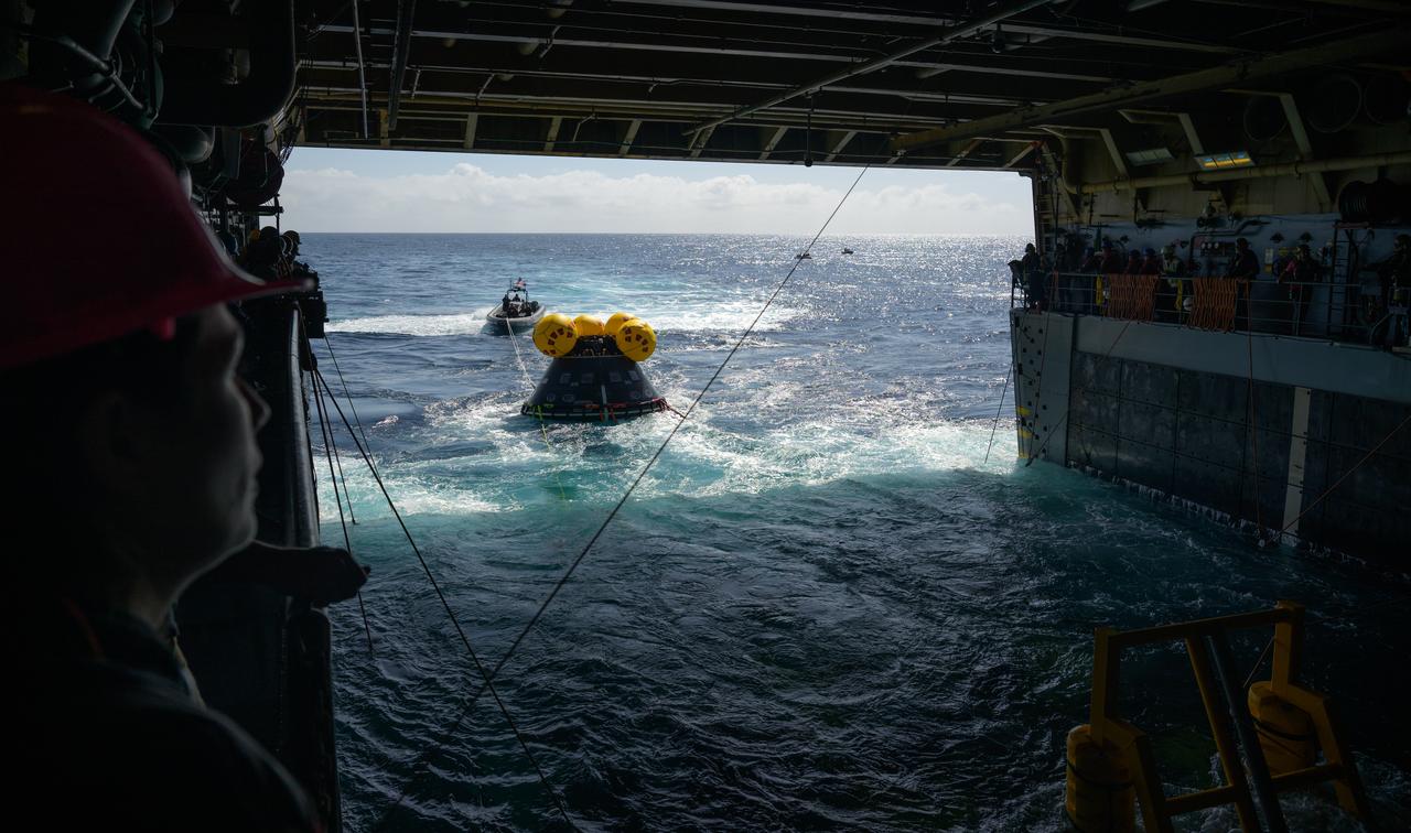 The Crew Module Test Article (CMTA), a full scale mockup of the Orion spacecraft, is seen as it is deployed from USS Somerset during the Underway Recovery Test-12, off the coast of California, Friday, March 28, 2025. During the test, NASA and Department of Defense teams are practicing to ensure recovery procedures are validated as NASA plans to send Artemis II astronauts around the Moon and splashdown in the Pacific Ocean. Photo Credit: (NASA/Bill Ingalls)