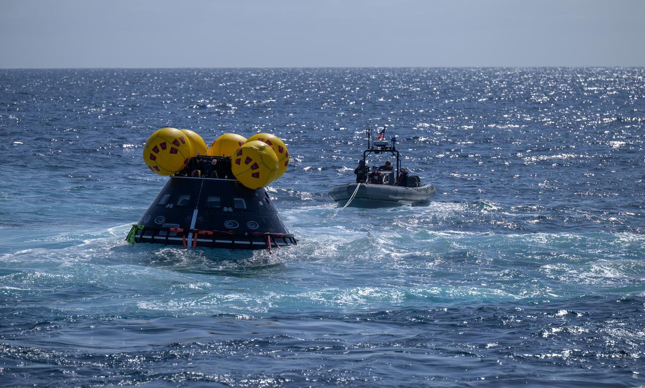 The Crew Module Test Article (CMTA), a full scale mockup of the Orion spacecraft, is seen during Underway Recovery Test-12 off the coast of California, Friday, March 28, 2025. During the test, NASA and Department of Defense teams are practicing to ensure recovery procedures are validated as NASA plans to send Artemis II astronauts around the Moon and splashdown in the Pacific Ocean.  Photo Credit: (NASA/Bill Ingalls)