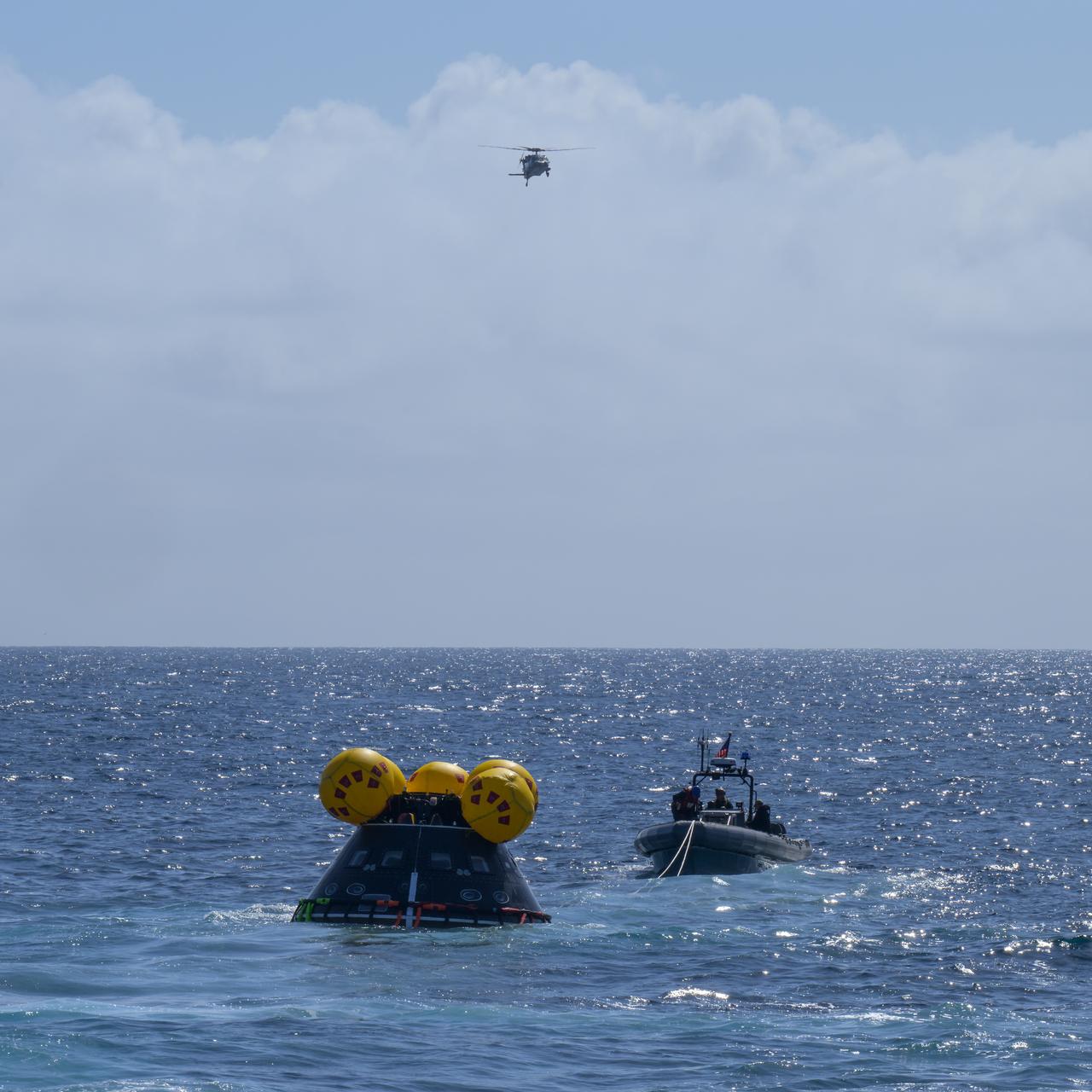 The Crew Module Test Article (CMTA), a full scale mockup of the Orion spacecraft, is seen during Underway Recovery Test-12 off the coast of California, Friday, March 28, 2025. During the test, NASA and Department of Defense teams are practicing to ensure recovery procedures are validated as NASA plans to send Artemis II astronauts around the Moon and splashdown in the Pacific Ocean.  Photo Credit: (NASA/Bill Ingalls)