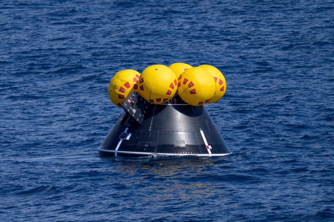 The Crew Module Test Article (CMTA), a full scale mockup of the Orion spacecraft, is seen during Underway Recovery Test-12 off the coast of California, Friday, March 28, 2025. During the test, NASA and Department of Defense teams are practicing to ensure recovery procedures are validated as NASA plans to send Artemis II astronauts around the Moon and splashdown in the Pacific Ocean.  Photo Credit: (NASA/Bill Ingalls)