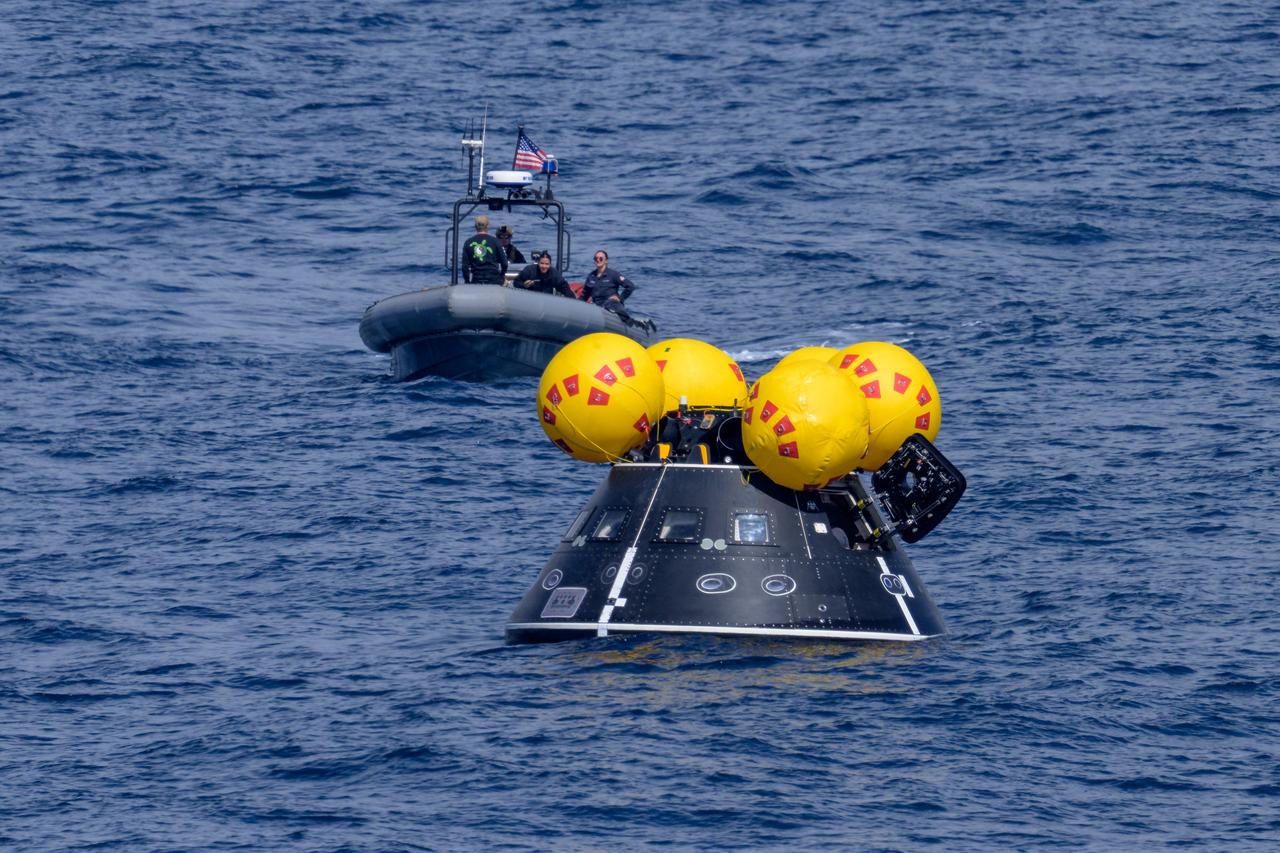 The Crew Module Test Article (CMTA), a full scale mockup of the Orion spacecraft, is seen during Underway Recovery Test-12 off the coast of California, Friday, March 28, 2025. During the test, NASA and Department of Defense teams are practicing to ensure recovery procedures are validated as NASA plans to send Artemis II astronauts around the Moon and splashdown in the Pacific Ocean.  Photo Credit: (NASA/Bill Ingalls)