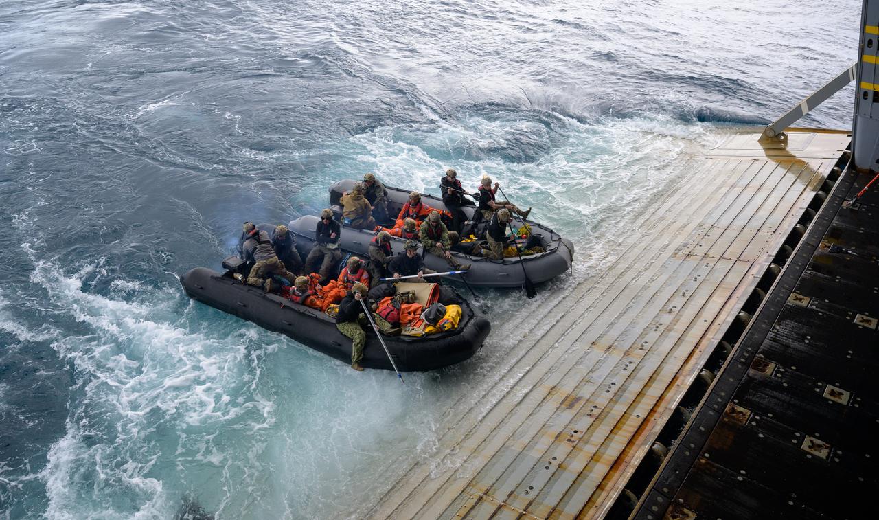 ESA (European Space Agency) astronaut Luca Parmitano, and NASA astronauts Andre Douglas, Deniz Burnham, and Stan Love, right, board boats to deliver them to the Crew Module Test Article (CMTA), a full scale mockup of the Orion spacecraft, during Underway Recovery Test-12 off the coast of California, Friday, March 28, 2025. During the test, NASA and Department of Defense teams are practicing to ensure recovery procedures are validated as NASA plans to send Artemis II astronauts around the Moon and splashdown in the Pacific Ocean. Photo Credit: (NASA/Bill Ingalls)