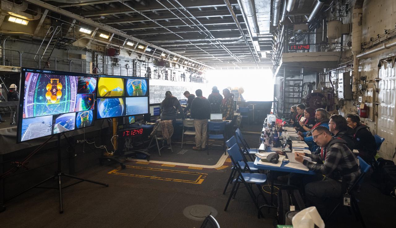 Teams prepare to release the Crew Module Test Article (CMTA) in the Pacific Ocean during Underway Recovery Test-12 onboard USS Somerset off the coast of California, Friday, March 28, 2025. During the test, NASA and Department of Defense teams are practicing to ensure recovery procedures are validated as NASA plans to send the Artemis II astronauts around the Moon and splashdown in the Pacific Ocean. Photo Credit: (NASA/Joel Kowsky)