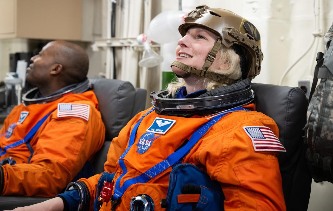 NASA astronaut Deniz Burnham is seen as she prepares to take part in practicing Artemis recovery procedures during Underway Recovery Test-12 onboard USS Somerset off the coast of California, Friday, March 28, 2025. During the test, NASA and Department of Defense teams are practicing to ensure recovery procedures are validated as NASA plans to send the Artemis II astronauts around the Moon and splashdown in the Pacific Ocean.  Photo Credit: (NASA/Joel Kowsky)