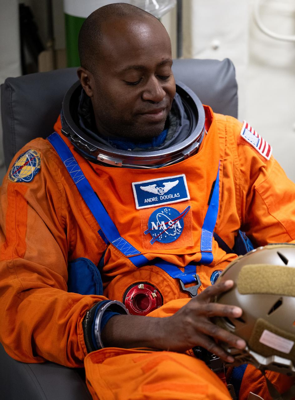 NASA astronaut Andre Douglas is seen as he prepares to take part in practicing Artemis recovery procedures during Underway Recovery Test-12 onboard USS Somerset off the coast of California, Friday, March 28, 2025. During the test, NASA and Department of Defense teams are practicing to ensure recovery procedures are validated as NASA plans to send the Artemis II astronauts around the Moon and splashdown in the Pacific Ocean.  Photo Credit: (NASA/Joel Kowsky)