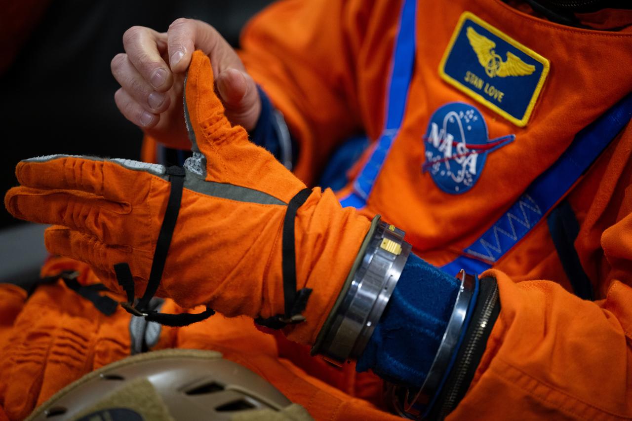 NASA astronaut Stan Love is seen as he prepares to take part in practicing Artemis recovery procedures during Underway Recovery Test-12 onboard USS Somerset off the coast of California, Friday, March 28, 2025. During the test, NASA and Department of Defense teams are practicing to ensure recovery procedures are validated as NASA plans to send the Artemis II astronauts around the Moon and splashdown in the Pacific Ocean. Photo Credit: (NASA/Joel Kowsky)