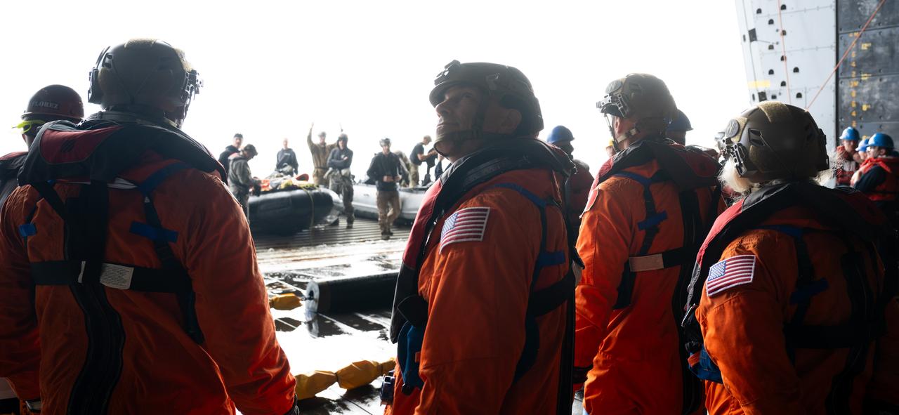 NASA astronaut Stan Love is seen as he and fellow NASA astronauts Andre Douglas and Deniz Burnham and ESA (European Space Agency) astronaut Luca Parmitano prepare to be taken to the Crew Module Test Article (CMTA) to take part in practicing Artemis recovery operations during Underway Recovery Test-12 onboard USS Somerset off the coast of California, Friday, March 28, 2025. During the test, NASA and Department of Defense teams are practicing to ensure recovery procedures are validated as NASA plans to send the Artemis II astronauts around the Moon and splashdown in the Pacific Ocean.  Photo Credit: (NASA/Joel Kowsky)