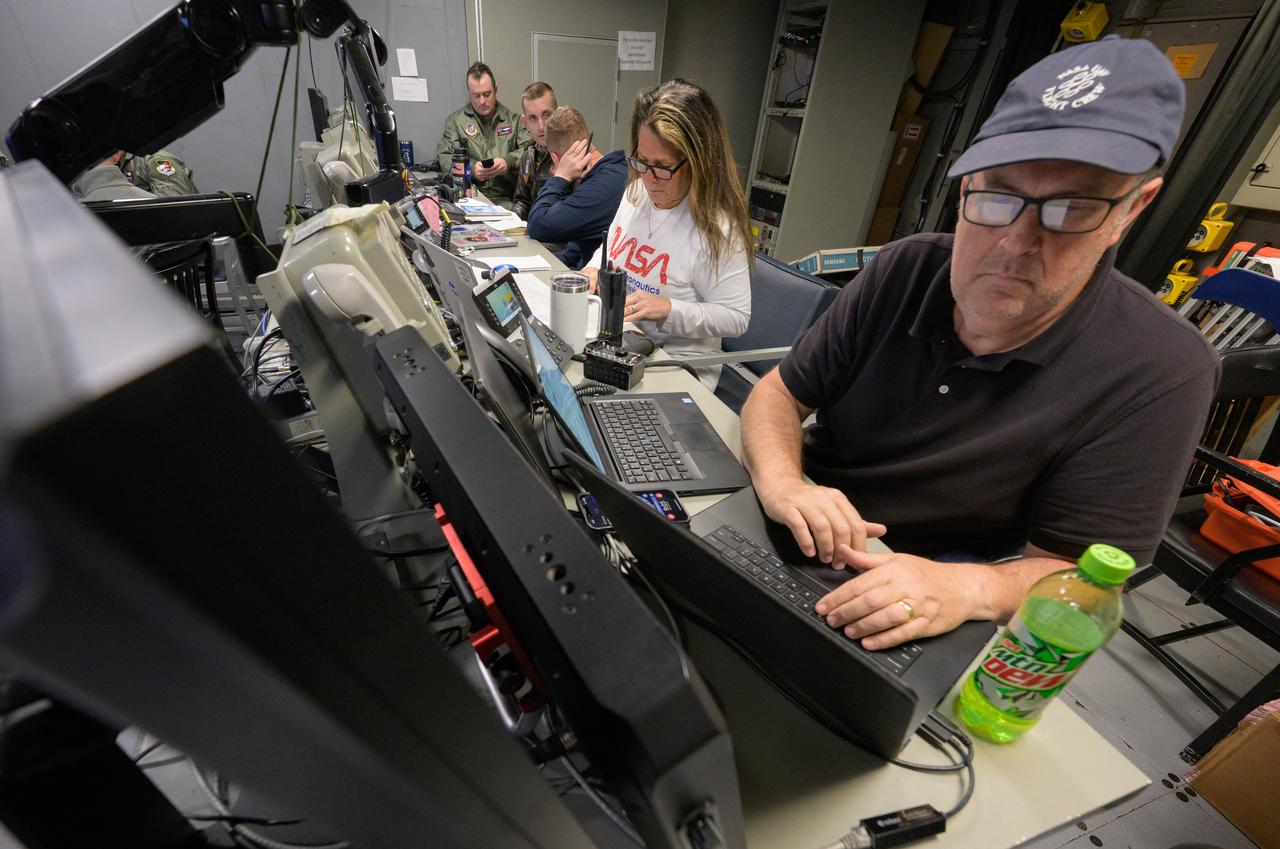 Members of the NASA and Department of Defense recovery team work inside the Landing Force Operations Center onboard USS Somerset as they practice Artemis recovery operations during Underway Recovery Test-12 off the coast of California, Saturday, March 29, 2025. During the test, NASA and Department of Defense teams are practicing to ensure recovery procedures are validated as NASA plans to send Artemis II around the Moon and splashdown in the Pacific Ocean.  Photo Credit: (NASA/Bill Ingalls)