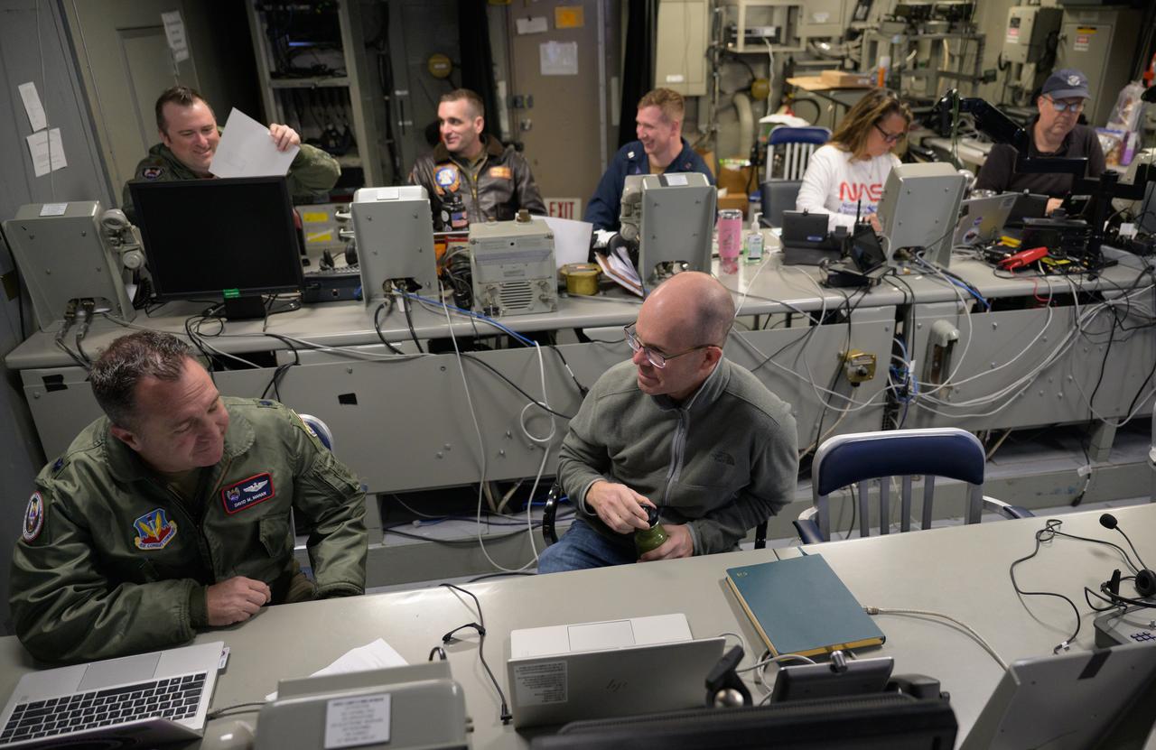 Members of the NASA and Department of Defense recovery team work inside the Landing Force Operations Center onboard USS Somerset as they practice Artemis recovery operations during Underway Recovery Test-12 off the coast of California, Saturday, March 29, 2025. During the test, NASA and Department of Defense teams are practicing to ensure recovery procedures are validated as NASA plans to send Artemis II around the Moon and splashdown in the Pacific Ocean.  Photo Credit: (NASA/Bill Ingalls)