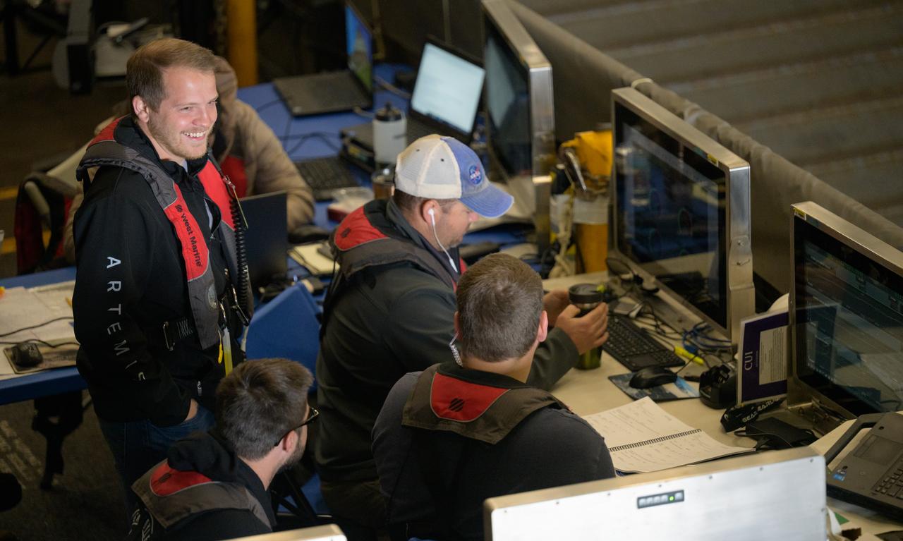 Members of NASA’s Landing and Recovery team are seen as they recover the Crew Module Test Article (CMTA), a full scale mockup of the Orion spacecraft, as teams  practice Artemis recovery operations during Underway Recovery Test-12 onboard USS Somerset off the coast of California, Saturday, March 29, 2025. During the test, NASA and Department of Defense teams are practicing to ensure recovery procedures are validated as NASA plans to send Artemis II around the Moon and splashdown in the Pacific Ocean.  Photo Credit: (NASA/Bill Ingalls)