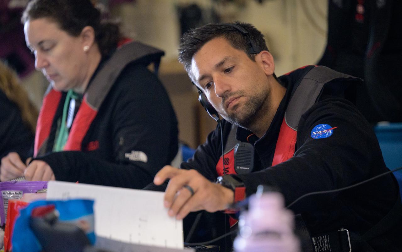 NASA Test Director Daniel Florez is seen as he and other members of NASA’s Landing and Recovery team recover the Crew Module Test Article (CMTA), a full scale mockup of the Orion spacecraft, as teams  practice Artemis recovery operations during Underway Recovery Test-12 onboard USS Somerset off the coast of California, Saturday, March 29, 2025. During the test, NASA and Department of Defense teams are practicing to ensure recovery procedures are validated as NASA plans to send Artemis II around the Moon and splashdown in the Pacific Ocean.  Photo Credit: (NASA/Bill Ingalls)