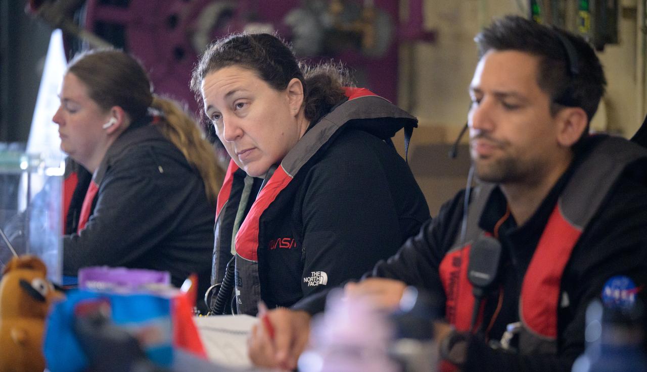 Members of NASA’s Landing and Recovery team are seen as they recover the Crew Module Test Article (CMTA), a full scale mockup of the Orion spacecraft, as teams practice Artemis recovery operations during Underway Recovery Test-12 onboard USS Somerset off the coast of California, Saturday, March 29, 2025. During the test, NASA and Department of Defense teams are practicing to ensure recovery procedures are validated as NASA plans to send Artemis II around the Moon and splashdown in the Pacific Ocean. Photo Credit: (NASA/Bill Ingalls)