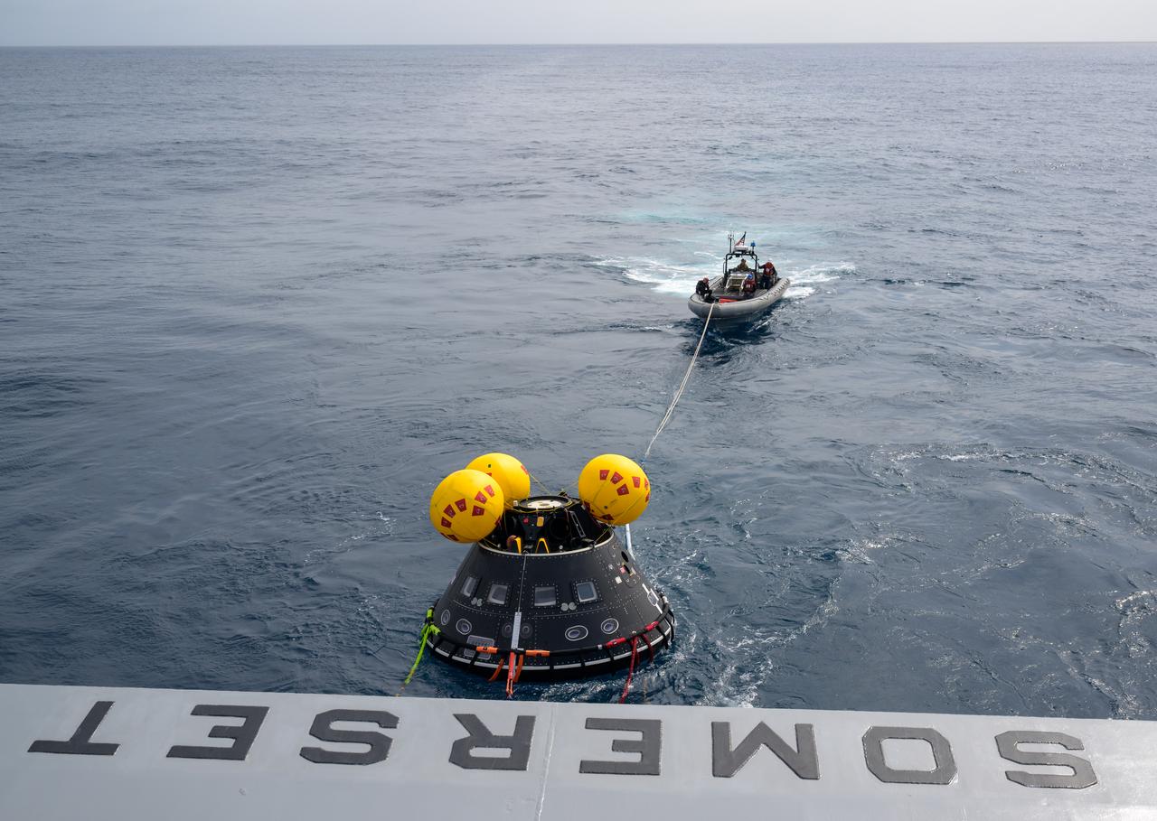 The Crew Module Test Article (CMTA), a full scale mockup of the Orion spacecraft, is seen in the Pacific Ocean as teams practice Artemis recovery operations during Underway Recovery Test-12 onboard USS Somerset off the coast of California, Saturday, March 29, 2025. During the test, NASA and Department of Defense teams are practicing to ensure recovery procedures are validated as NASA plans to send Artemis II around the Moon and splashdown in the Pacific Ocean. Photo Credit: (NASA/Bill Ingalls)