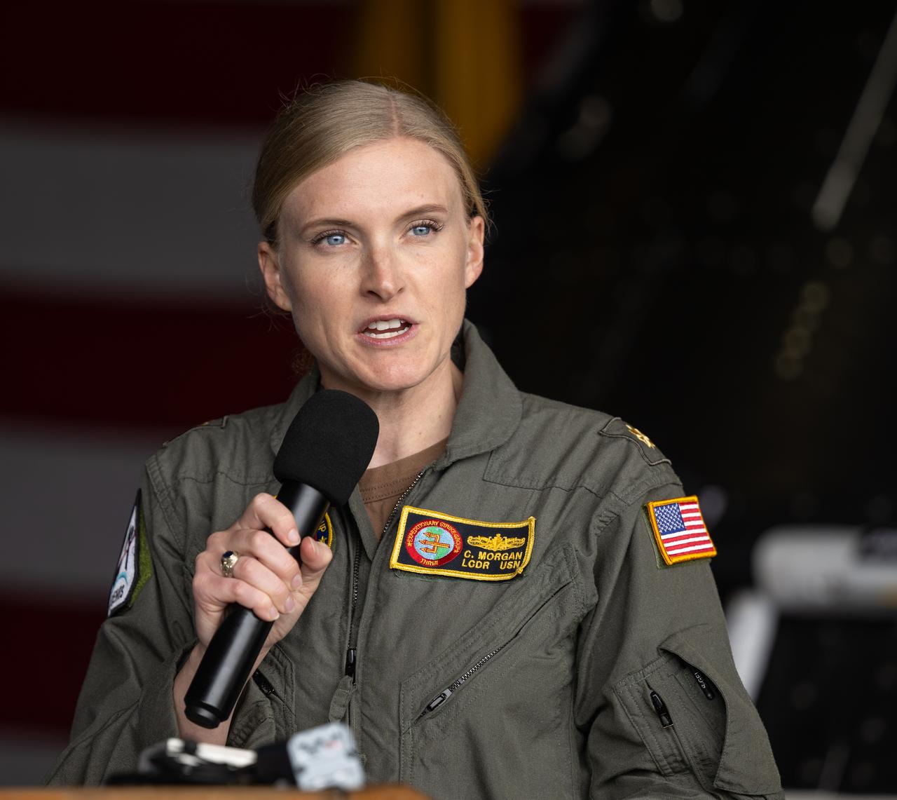 Chloe Morgan, Expeditionary Strike Group 3 Public Affairs Officer gives remarks during a media event where NASA and the Department of Defense discussed the recovery operations that will bring the Artemis II astronauts and the agency’s Orion spacecraft home at the conclusion of next year’s mission around the Moon, Monday, March 31, 2025, onboard USS Somerset at Naval Base San Diego, in California. The teams spent the week practicing the procedures they will use to recover the astronauts after their more than 600,000 mile journey from Earth to the Moon and back on the first crewed mission under the Artemis campaign. Photo Credit: (NASA/Bill Ingalls)