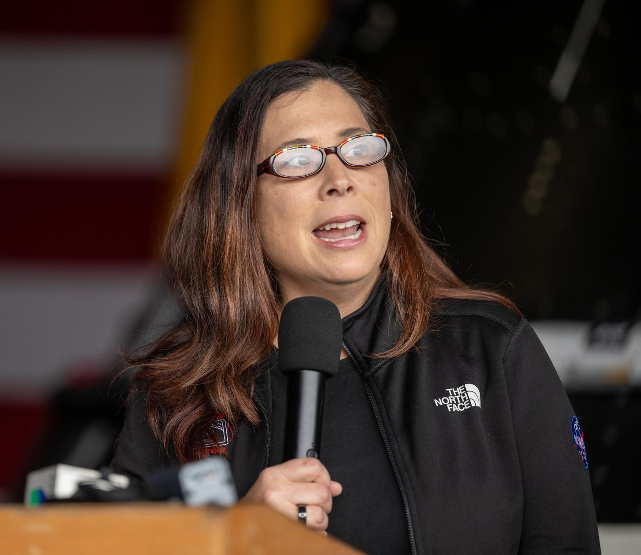 Liliana Villarreal, NASA’s Artemis II landing and recovery director, Exploration Ground Systems Program, gives remarks during a media event where NASA and the Department of Defense discussed the recovery operations that will bring the Artemis II astronauts and the agency’s Orion spacecraft home at the conclusion of next year’s mission around the Moon, Monday, March 31, 2025, onboard USS Somerset at Naval Base San Diego, in California. The teams spent the week practicing the procedures they will use to recover the astronauts after their more than 600,000 mile journey from Earth to the Moon and back on the first crewed mission under the Artemis campaign. Photo Credit: (NASA/Bill Ingalls)