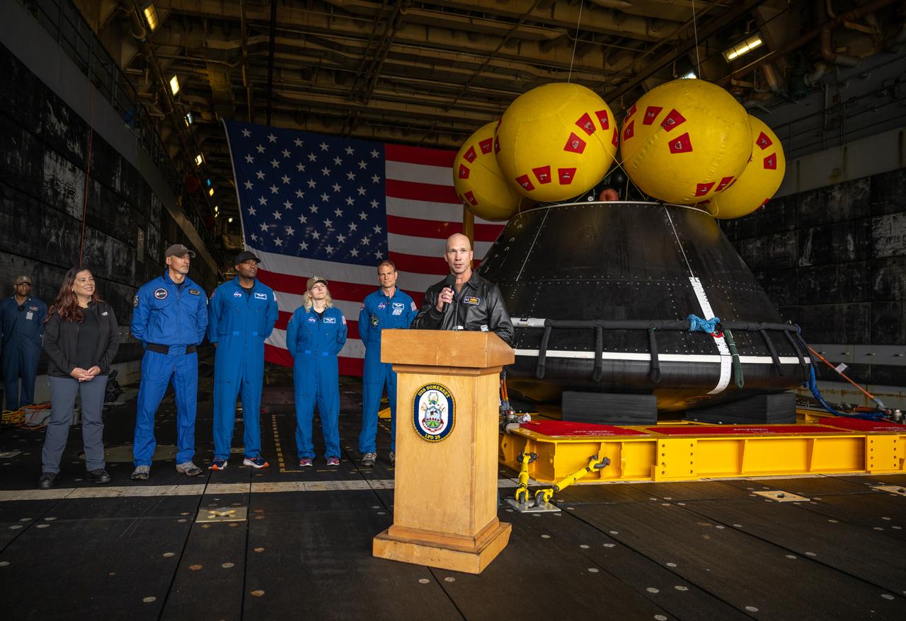 Capt. Andrew “Andy” Koy, commanding officer of USS Somerset (LPD 25), U.S. Navy, gives remarks during a media event where NASA and the Department of Defense discussed the recovery operations that will bring the Artemis II astronauts and the agency’s Orion spacecraft home at the conclusion of next year’s mission around the Moon, Monday, March 31, 2025, onboard USS Somerset at Naval Base San Diego, in California. The teams spent the week practicing the procedures they will use to recover the astronauts after their more than 600,000 mile journey from Earth to the Moon and back on the first crewed mission under the Artemis campaign. Photo Credit: (NASA/Bill Ingalls)
