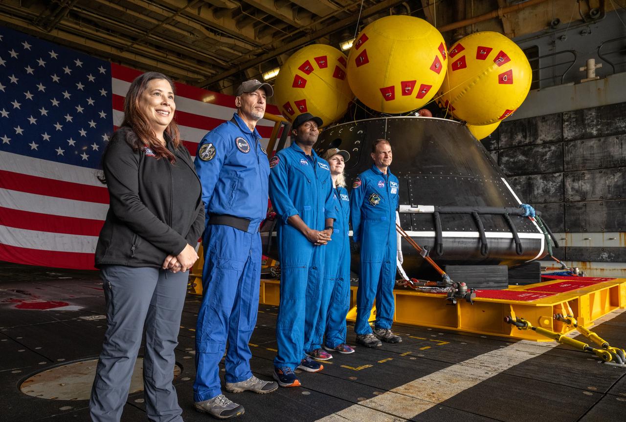 Liliana Villarreal, NASA’s Artemis II landing and recovery director, Exploration Ground Systems Program, left, ESA (European Space Agency) astronaut Luca Parmitano, and NASA astronauts Andre Douglas, Deniz Burnham, and Stan Love, are seen during a media event where NASA and the Department of Defense discussed the recovery operations that will bring the Artemis II astronauts and the agency’s Orion spacecraft home at the conclusion of next year’s mission around the Moon, Monday, March 31, 2025, onboard USS Somerset at Naval Base San Diego, in California. The teams spent the week practicing the procedures they will use to recover the astronauts after their more than 600,000 mile journey from Earth to the Moon and back on the first crewed mission under the Artemis campaign. Photo Credit: (NASA/Bill Ingalls)
