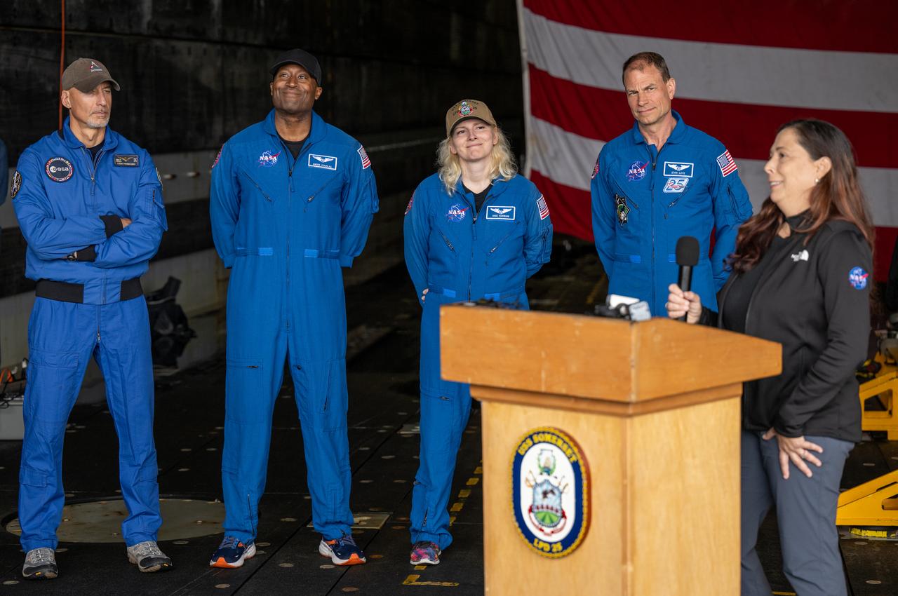 ESA (European Space Agency) astronaut Luca Parmitano, left, NASA astronauts Andre Douglas, Deniz Burnham, and Stan Love, and Liliana Villarreal, NASA’s Artemis II landing and recovery director, Exploration Ground Systems Program, right, are seen during a media event where NASA and the Department of Defense discussed the recovery operations that will bring the Artemis II astronauts and the agency’s Orion spacecraft home at the conclusion of next year’s mission around the Moon, Monday, March 31, 2025, onboard USS Somerset at Naval Base San Diego, in California. The teams spent the week practicing the procedures they will use to recover the astronauts after their more than 600,000 mile journey from Earth to the Moon and back on the first crewed mission under the Artemis campaign. Photo Credit: (NASA/Bill Ingalls)