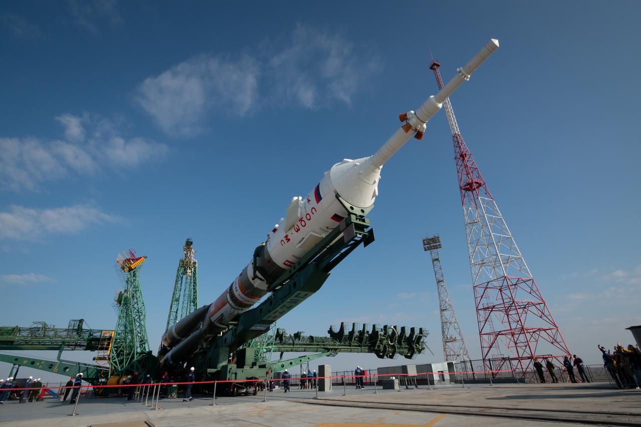 The Soyuz rocket is seen as it is raised into the vertical position at the launch pad at Site 31, Saturday, April 5, 2025, at the Baikonur Cosmodrome in Kazakhstan. Expedition 73 crewmembers: NASA astronaut Jonny Kim, and Roscosmos cosmonauts Sergey Ryzhikov and Alexey Zubritskiy, are scheduled to launch aboard their Soyuz MS-27 spacecraft on April 8. Photo Credit: (NASA/Victor Zelentsov)