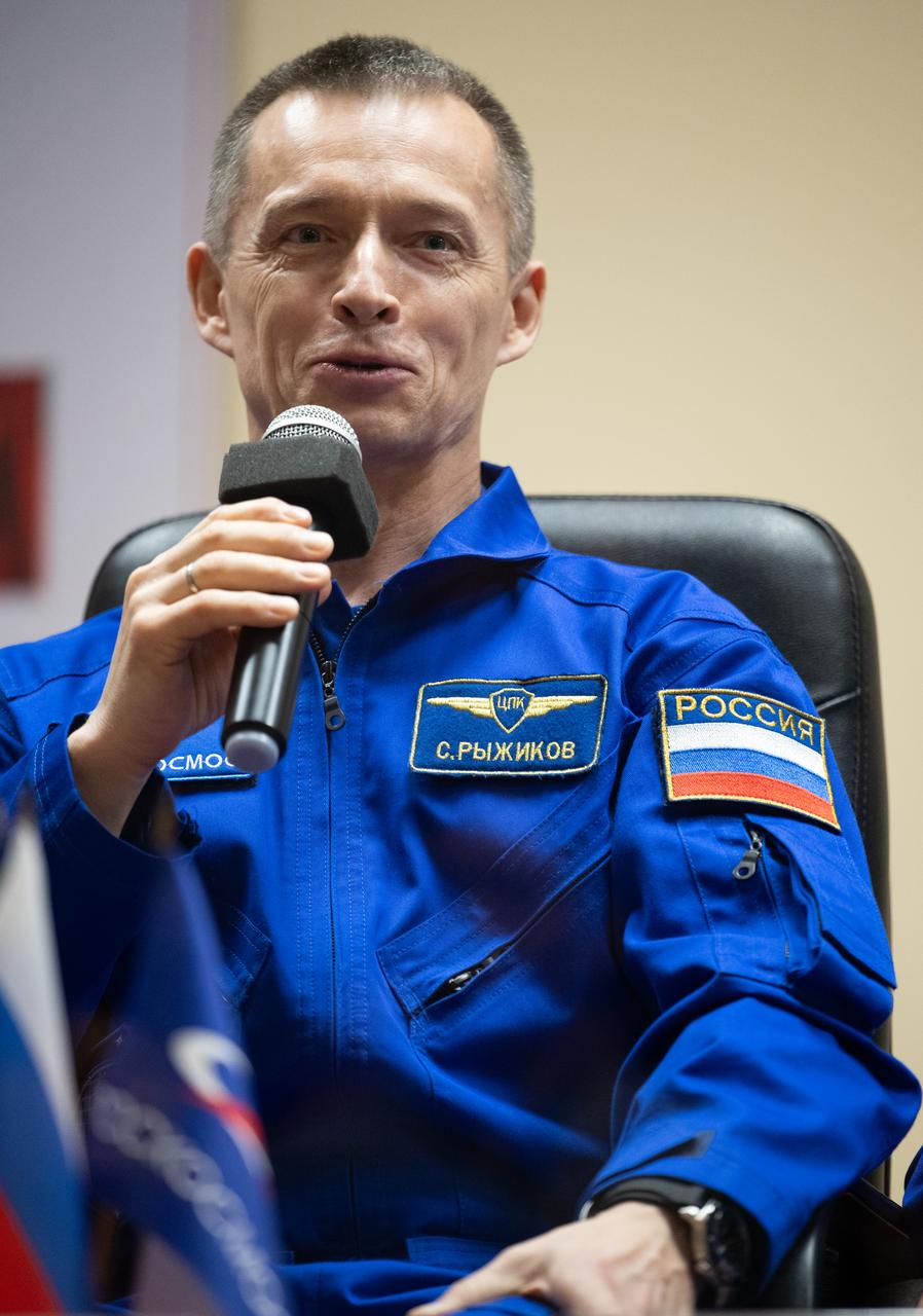 Roscosmos cosmonaut Sergey Ryzhikov is seen in quarantine, behind glass, during a press conference, Monday, April 7, 2025 a the Cosmonaut Hotel in Baikonur, Kazakhstan. Expedition 73 crew members: NASA astronaut Jonny Kim, and Roscosmos cosmonauts Sergey Ryzhikov and Alexey Zubritskiy, are scheduled to launch aboard their Soyuz MS-27 spacecraft on April 8. Photo Credit: (NASA/Joel Kowsky)