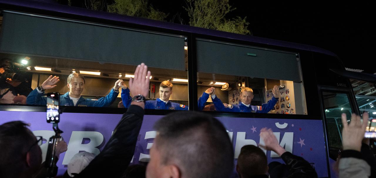 NASA astronaut Jonny Kim, left, and Roscosmos cosmonauts Alexey Zubritskiy and Sergey Ryzhikov, right, are seen as they depart the Cosmonaut Hotel to suit-up for their Soyuz launch to the International Space Station, Tuesday, April 8, 2025 (April 7 Eastern Time), in Baikonur, Kazakhstan. The launch will send Kim, Ryzhikov, Zubritskiy on a mission to the International Space Station. Photo Credit: (NASA/Joel Kowsky)