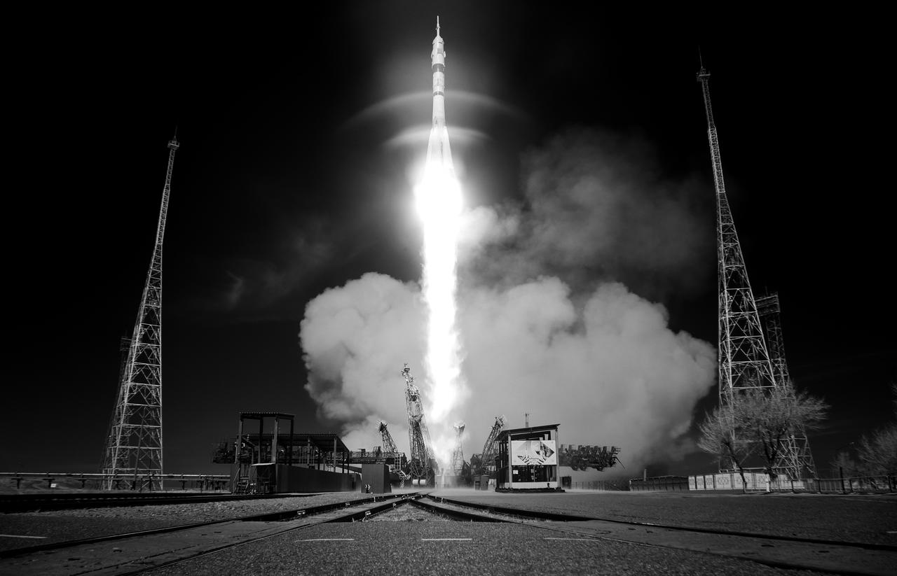 In this black and white infrared image, a Soyuz rocket launches to the International Space Station with Expedition 73 crew members: NASA astronaut Jonny Kim, and Roscosmos cosmonauts Sergey Ryzhikov and Alexey Zubritskiy onboard, Tuesday, April 8, 2025, at the Baikonur Cosmodrome in Kazakhstan. Photo Credit: (NASA/Joel Kowsky)