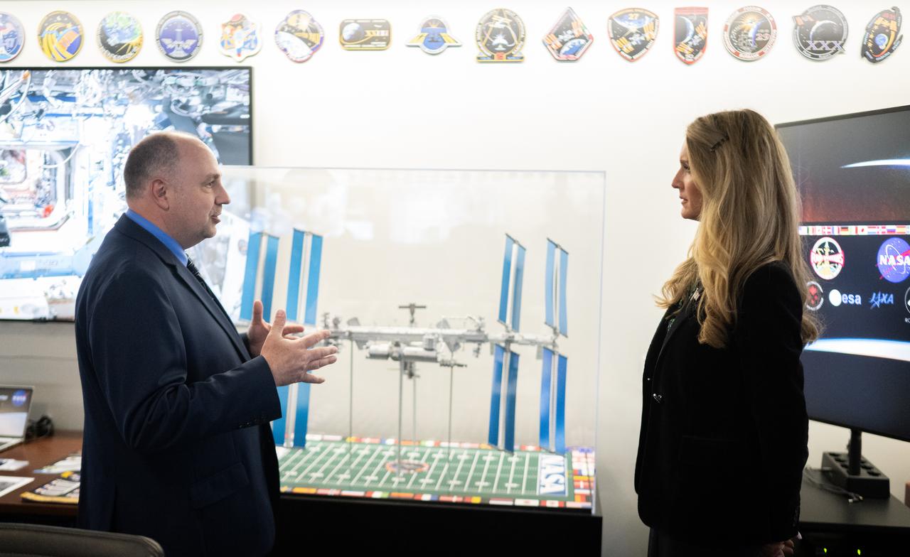 Kevin Metrocavage, manager of the Space Operations Center at NASA Headquarters, left, speaks with Administrator of the Small Business Administration Kelly Loeffler during a visit to the Space Operations Center, Wednesday, April 16, 2025, at the Mary W. Jackson NASA Headquarters building in Washington. Photo Credit: (NASA/Joel Kowsky)