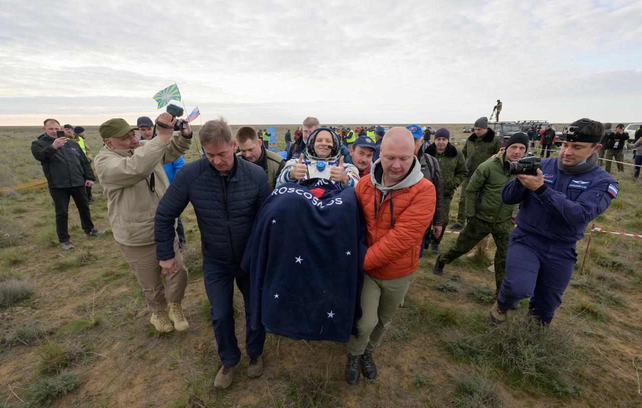 Roscosmos cosmonaut Ivan Vagner is carried to a medical tent shortly after he, Roscosmos cosmonaut Alexey Ovchinin, and NASA astronaut Don Pettit landed in their Soyuz MS-26 spacecraft near the town of Zhezkazgan, Kazakhstan on Sunday, April 20, 2025, (April 19 Eastern). The trio returned to Earth after logging 220 days in space as members of Expeditions 71 and 72 aboard the International Space Station. Photo Credit: (NASA/Bill Ingalls)