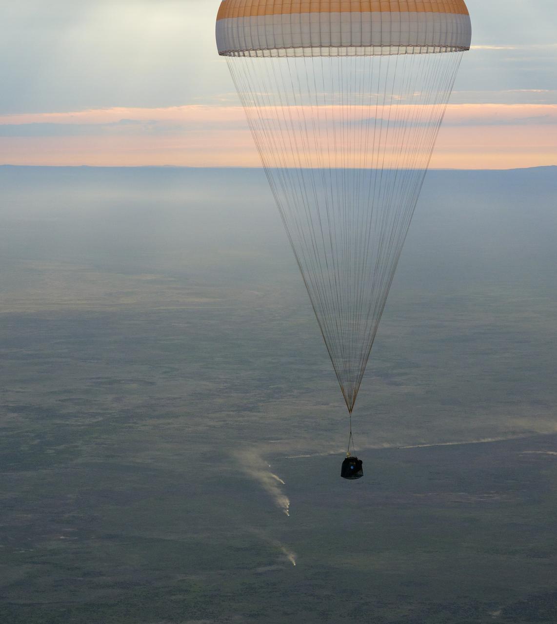 The Soyuz MS-26 spacecraft is seen as it lands in a remote area near the town of Zhezkazgan, Kazakhstan with Expedition 72 NASA astronaut Don Pettit, and Roscosmos cosmonauts Alexey Ovchinin and Ivan Vagner aboard, Sunday, April 20, 2025, (April 19 Eastern). The trio are returning to Earth after logging 220 days in space as members of Expeditions 71 and 72 aboard the International Space Station. Photo Credit: (NASA/Bill Ingalls)