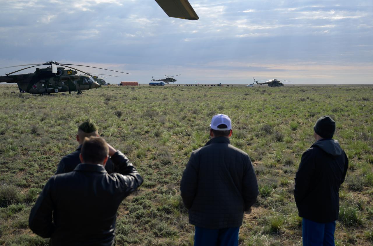Russian support personnel work around the Soyuz MS-26 spacecraft shortly after it landed in a remote area near the town of Zhezkazgan, Kazakhstan with Expedition 72 NASA astronaut Don Pettit, and Roscosmos cosmonauts Alexey Ovchinin and Ivan Vagner aboard, Sunday, April 20, 2025, (April 19 Eastern). The trio returned to Earth after logging 220 days in space as members of Expeditions 71 and 72 aboard the International Space Station. Photo Credit: (NASA/Bill Ingalls)