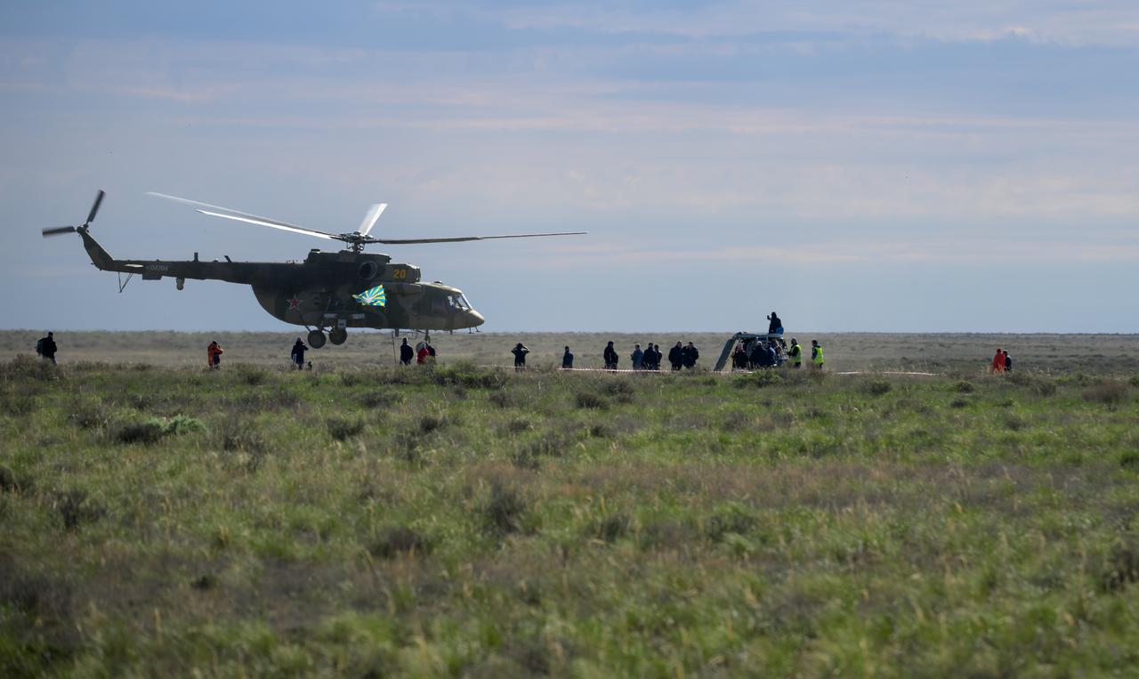 Russian support personnel work around the Soyuz MS-26 spacecraft shortly after it landed in a remote area near the town of Zhezkazgan, Kazakhstan with Expedition 72 NASA astronaut Don Pettit, and Roscosmos cosmonauts Alexey Ovchinin and Ivan Vagner aboard, Sunday, April 20, 2025, (April 19 Eastern). The trio returned to Earth after logging 220 days in space as members of Expeditions 71 and 72 aboard the International Space Station. Photo Credit: (NASA/Bill Ingalls)