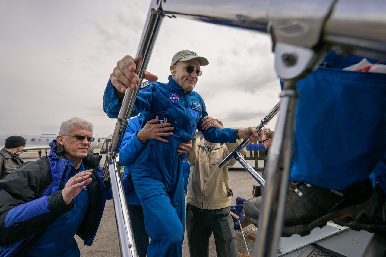 NASA astronaut Don Pettit boards a NASA airplane to take him from Karaganda, Kazakhstan to Houston after he, Roscosmos cosmonauts Alexey Ovchinin, and Ivan Vagner landed in their Soyuz MS-26 spacecraft near the town of Zhezkazgan, Kazakhstan on Sunday, April 20, 2025, (April 19 Eastern). The trio returned to Earth after logging 220 days in space as members of Expeditions 71 and 72 aboard the International Space Station. Photo Credit: (NASA/Bill Ingalls)