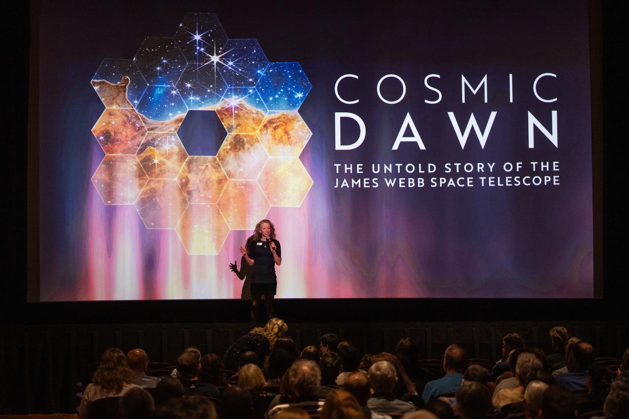 Caitlin McGrath, executive director of the Greenbelt Cinema, welcomes attendees before a screening of the new NASA+ documentary “Cosmic Dawn: The Untold Story of the James Webb Space Telescope,” Wednesday, June 11, 2025, at the Greenbelt Cinema in Greenbelt, Maryland. Featuring never-before-seen footage, Cosmic Dawn offers an unprecedented glimpse into the assembly, testing, and launch of NASA’s James Webb Space Telescope.   Photo Credit: (NASA/Joel Kowsky)