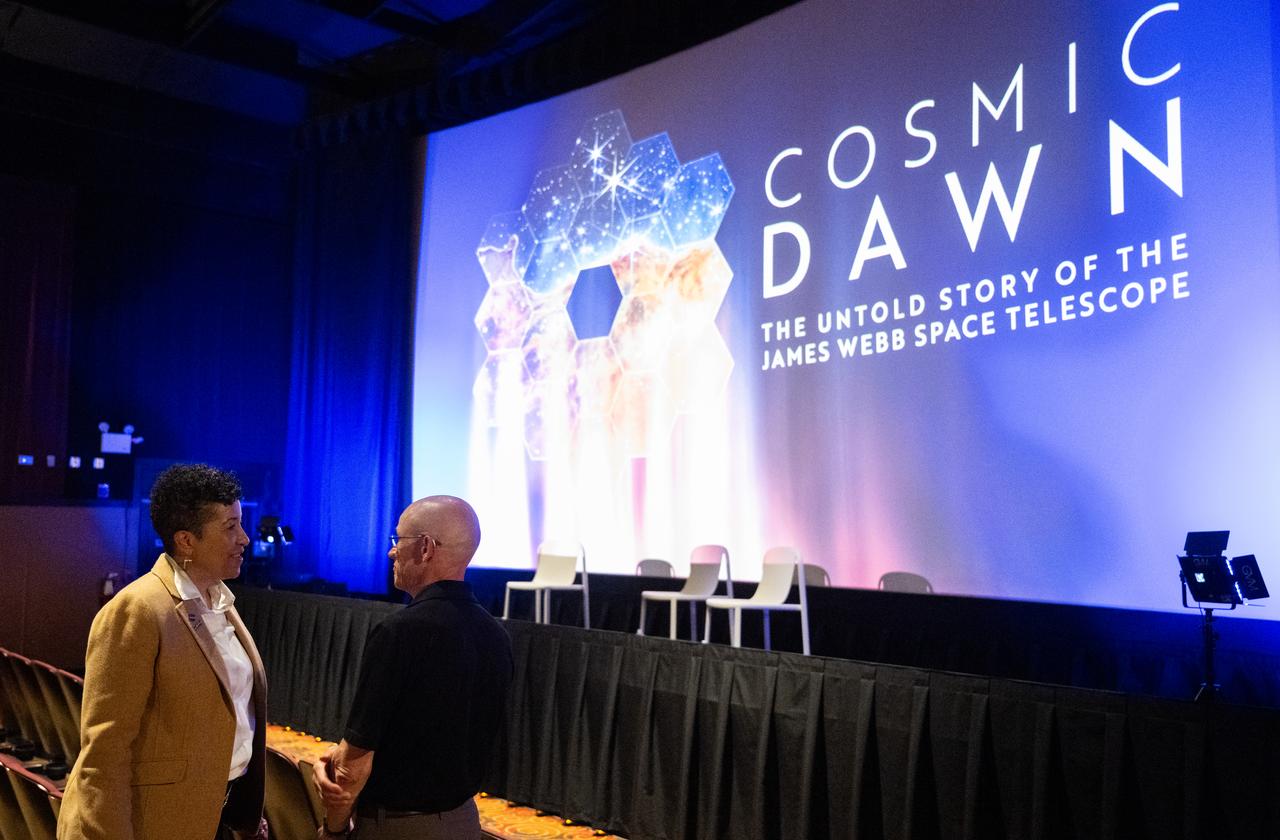 Cynthia Simmons, deputy director of NASA’s Goddard Space Flight Center, left, speaks with Paul Geithner, former deputy project manager for NASA’s James Webb Space Telescope before a screening of the new NASA+ documentary “Cosmic Dawn: The Untold Story of the James Webb Space Telescope,” Wednesday, June 11, 2025, at the Greenbelt Cinema in Greenbelt, Maryland. Featuring never-before-seen footage, Cosmic Dawn offers an unprecedented glimpse into the assembly, testing, and launch of NASA’s James Webb Space Telescope.   Photo Credit: (NASA/Joel Kowsky)