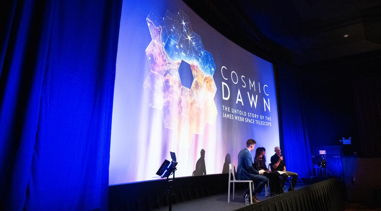 Jacob Pinter, host of NASA’s Curious Universe Podcast, left, leads a discussion with Sophia Roberts, a NASA video producer who documented the Webb project, center, and Paul Geithner, former deputy project manager for NASA’s James Webb Space Telescope, right, following a screening of the new NASA+ documentary “Cosmic Dawn: The Untold Story of the James Webb Space Telescope,” Wednesday, June 11, 2025, at the Greenbelt Cinema in Greenbelt, Maryland. Featuring never-before-seen footage, Cosmic Dawn offers an unprecedented glimpse into the assembly, testing, and launch of NASA’s James Webb Space Telescope.   Photo Credit: (NASA/Joel Kowsky)